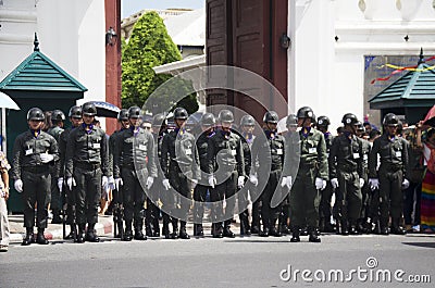 Soldiers stand in row at front of Wat Phra Kaew temple Editorial Stock Photo